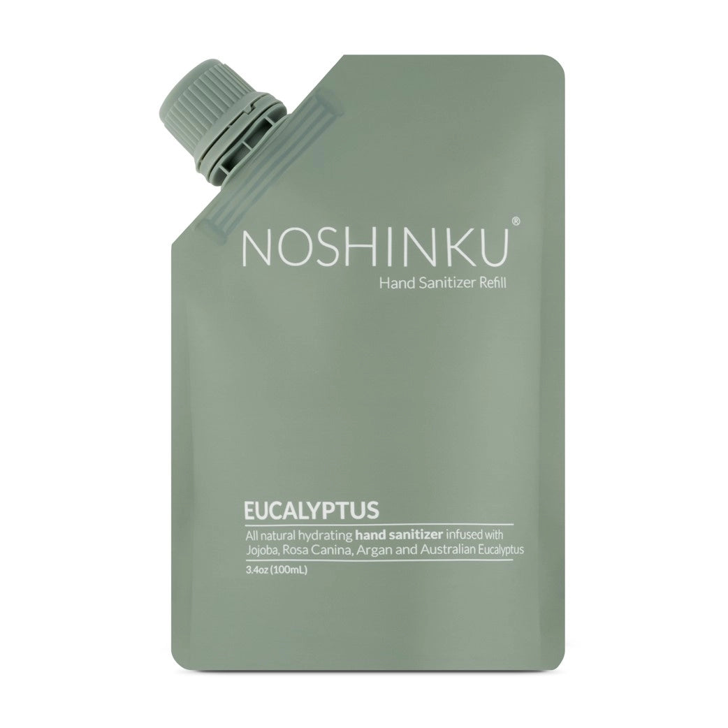 Front-facing product image of the Noshinku Eucalyptus Hand Sanitizer Refill Pouch in soft sage green minimalist packaging with a screw-top refill cap.