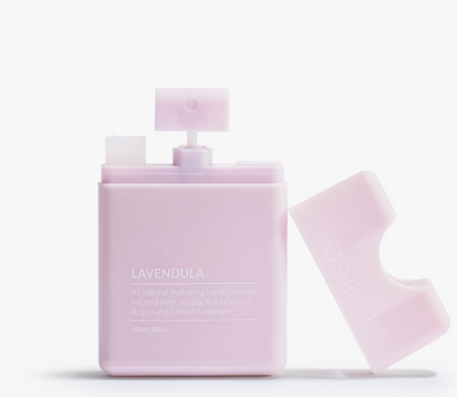 Open Noshinku Lavendula refillable moisturizing hand sanitizer spray bottle in soft lavender packaging. Exclusively at Area Boutique.
