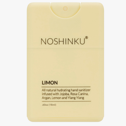 Front-facing product shot of the Noshinku Lemon refillable pocket hand sanitizer spray in a soft pastel yellow bottle with slim minimalist packaging.