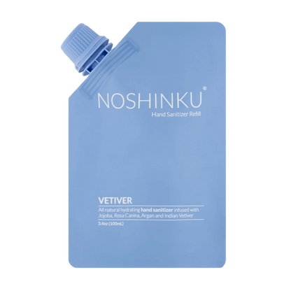 Front-facing product image of the Noshinku Vetiver Hand Sanitizer Refill Pouch in soft blue minimalist packaging with a screw-top refill cap.